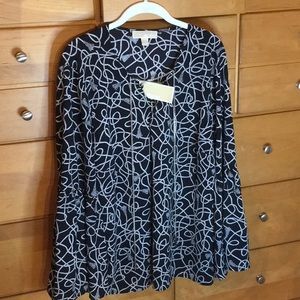 Bell sleeved blouse with chain detail.